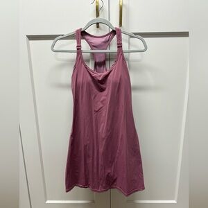Athletic dress with shorts. Pinkish mauve color.